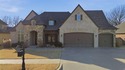 Stunning home backing to a private wooded preserve with for sale in Bixby Oklahoma Tulsa County County on GolfHomes.com