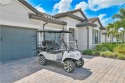 Elegant 4-Bedroom + Den Estate with Heated Pool, Extended 3-Car for sale in Estero Florida Lee County County on GolfHomes.com