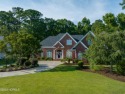 Located on a quiet, secluded cul de sac, this beautiful brick for sale in Southport North Carolina Brunswick County County on GolfHomes.com