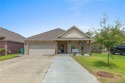 Modern 4-bedroom, 2-bathroom house positioned along the greens for sale in Westlake Louisiana Calcasieu Parish County on GolfHomes.com