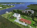 Step into a realm of pure Resort Style living and waterfront for sale in Quogue New York Suffolk County County on GolfHomes.com