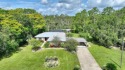 Charming Canal-Front Home on a Full Acre in Indian Lake Estates! for sale in Indian Lake Estates Florida Polk County County on GolfHomes.com