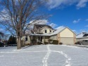 This home's  covered front porch and two story entryway welcomes for sale in Fenton Michigan Genesee County County on GolfHomes.com