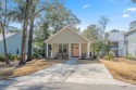 Simply fabulous! This 2-bedroom, 2-bath cottage-style home for sale in Pawleys Island South Carolina Georgetown County County on GolfHomes.com