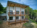 Experience expansive views of Brasstown Bald and the surrounding for sale in Young Harris Georgia Towns County County on GolfHomes.com