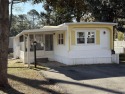 Welcome to this adorable three-bedroom, one-bath beach cottage for sale in Garden City Beach South Carolina Horry County County on GolfHomes.com