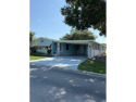 Indulge in expansive living within this magnificent double-wide for sale in Auburndale Florida Polk County County on GolfHomes.com