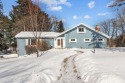 This charming 1.5-story home offers water access to Lake Iola for sale in Iola Wisconsin Waupaca County County on GolfHomes.com