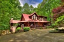 Welcome to your dream home! This stunning Satterwhite Log Home for sale in Ellijay Georgia Gilmer County County on GolfHomes.com