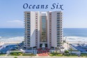 Welcome to Oceans Six! This stunning 3-bedroom, 2-bath condo for sale in Daytona Beach Shores Florida Volusia County County on GolfHomes.com