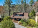 Experience the quintessential mountain getaway in this charming for sale in Cashiers North Carolina Jackson County County on GolfHomes.com