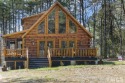 Builder's custom log cabin in exclusive and gated lake front for sale in Henderson North Carolina Vance County County on GolfHomes.com