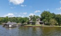 Set on a wide cove with open water views in the prestigious, Texas