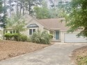 Experience the essence of coastal living in this well maintained for sale in Pine Knoll Shores North Carolina Carteret County County on GolfHomes.com