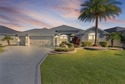 EXPANDED GARDENIA DESIGNER HOME with GOLF CAR GARAGE, LAKEFRONT for sale in The Villages Florida Lake County County on GolfHomes.com