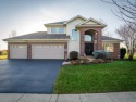 Step into luxury and tranquility with this beautiful 2-story for sale in Cherry Valley Illinois Winnebago County County on GolfHomes.com