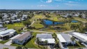 What a view! You'll love watching your friends hit the ball long for sale in Port Charlotte Florida Charlotte County County on GolfHomes.com