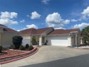 BACK ON THE MARKET!  Charming Courtyard Villa located in the for sale in The Villages Florida Sumter County County on GolfHomes.com
