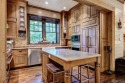 Explore the perfect blend of rustic charm and luxury in this for sale in Cashiers North Carolina Jackson County County on GolfHomes.com