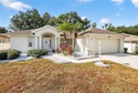 Welcome home to this lovely 3 Bed 2 Bath home in your Gated for sale in Leesburg Florida Lake County County on GolfHomes.com