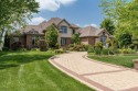 Welcome to this brick masterpiece on the fairway of Timber Point for sale in Poplar Grove Illinois Boone County County on GolfHomes.com