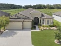 This stunning 3-bedroom, 3-bathroom home with an office and a for sale in Ocala Florida Marion County County on GolfHomes.com