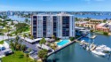 Enjoy Panoramic Water Views and Endless Sunsets from this for sale in Treasure Island Florida Pinellas County County on GolfHomes.com