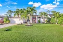 Nestled directly on the 16th hole of the prestigious Palmetto for sale in Cape Coral Florida Lee County County on GolfHomes.com