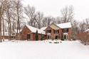 Custom-built 4-bedroom colonial set on a gorgeous 1-acre wooded for sale in Ann Arbor Michigan Washtenaw County County on GolfHomes.com