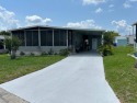 LOVELY DOUBLE-WIDE!  LARGE FRONT LANAI!  TURNKEY! FURNISHED for sale in Lakeland Florida Polk County County on GolfHomes.com