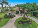 Drive up to the wide circular paved driveway surrounded by lush for sale in Estero Florida Lee County County on GolfHomes.com