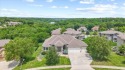 This is a stunning reverse 1.5-story home with picturesque views for sale in Lees Summit Missouri Jackson County County on GolfHomes.com