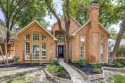 Professionally landscaped, brand new paint & carpet, wood floors for sale in Garland Texas Dallas County County on GolfHomes.com