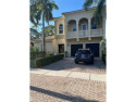 Beautifully appointed courtyard home located in an exclusive for sale in West Palm Beach Florida Palm Beach County County on GolfHomes.com