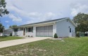 This two-bedroom, two-bathroom home features a two-car garage for sale in Ocala Florida Marion County County on GolfHomes.com