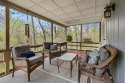 Nestled among mature trees, this charming 2-bedroom home offers for sale in Bella Vista Arkansas Benton County County on GolfHomes.com
