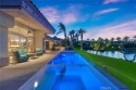 Mesmerizing and spectacular lake, infinity edge pool and golf for sale in Palm Desert California Riverside County County on GolfHomes.com