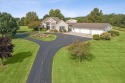 Experience luxury in this stunning executive-style home on 5 for sale in West Liberty Ohio Logan County County on GolfHomes.com