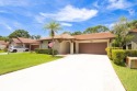 This beautiful 2/2/2 sitting on the 5th hole of the Golf Course for sale in Palm City Florida Martin County County on GolfHomes.com
