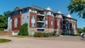 Looking for a top floor condo with priceless views of woods for sale in Riverside Iowa Washington County County on GolfHomes.com