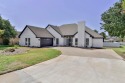 Enjoy living in in this one level, upscale Traditional home for sale in Granbury Texas Hood County County on GolfHomes.com