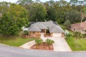 Custom concrete block home located in exclusive Spruce Creek for sale in Port Orange Florida Volusia County County on GolfHomes.com