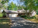 This spacious quad-level home is nestled on a double wooded lot for sale in Poplar Grove Illinois Boone County County on GolfHomes.com