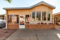 Step into this beautifully maintained & fully furnished for sale in Apache Junction Arizona Pinal County County on GolfHomes.com