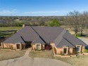 Welcome to this luxurious 3-bedroom, 3-full and 1-half-bathroom for sale in Shawnee Oklahoma Pottawatomie County County on GolfHomes.com
