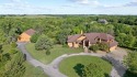 Colorado lodge style home, nestled on an expansive 20.12-acre for sale in Olathe Kansas Johnson County County on GolfHomes.com