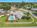 Fully REMODELED with a covered patio,fenced backyard, pool and for sale in Davie Florida Broward County County on GolfHomes.com