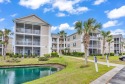 This top-floor, end unit is perfect for a primary residence for sale in Surfside Beach South Carolina Horry County County on GolfHomes.com