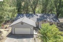 Tucked away on a peaceful cul-de-sac in the beautiful gated for sale in Groveland California Tuolumne County County on GolfHomes.com