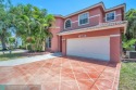 Discover this beautiful 2-story residence at the gated community for sale in Pompano Beach Florida Broward County County on GolfHomes.com